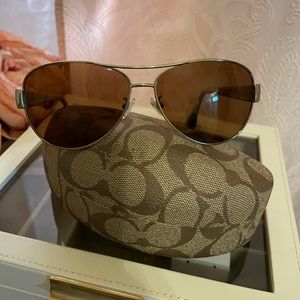 Coach women prescription sun glasses.